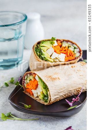 Vegan tortilla wraps with tofu, cucumber, carrots Vegan tortilla wraps with tofu, cucumber, carrots 63149335