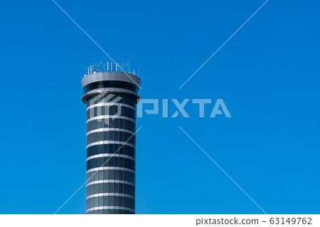 Air traffic control tower in the airport against Air traffic control tower in the airport against 63149762