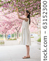 beautiful girl and cherry blossom 63152300