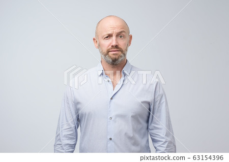 Doubt, mistrust, distrust concept. Mature man looking with disbelief expression Doubt, mistrust, distrust concept. Mature man looking with disbelief expression 63154396