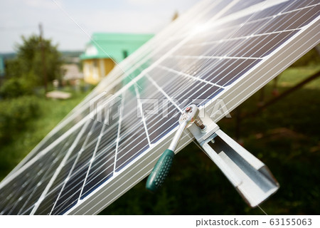 Alternative sun energy concept. Solar panels with wrench on sky background. 63155063