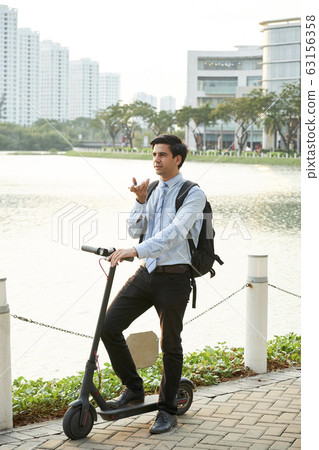 Entrepreneur recording voice message 63156358