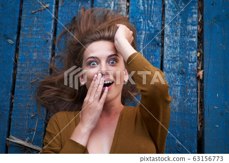 Beautiful caucasian young woman Lying on her back 63156773