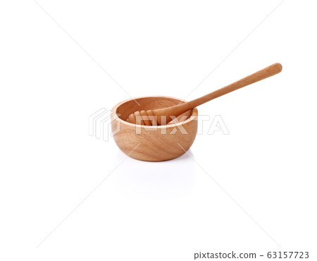 Wooden honey scoop isolated on white background 63157723