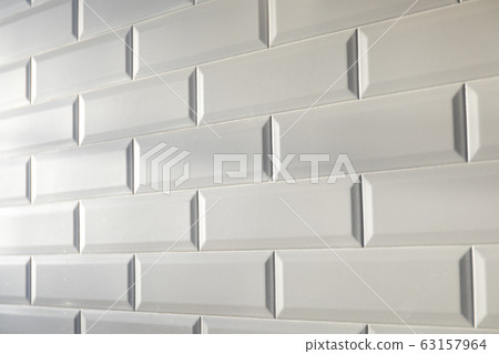 White tile background. Tiles in the kitchen White tile background. Tiles in the kitchen 63157964