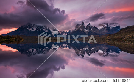 Majestic mountain landscape. Reflection of mountains in the lake. National Park Torres del Paine, Chile. 63158845
