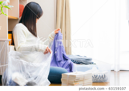 Women who throw away clothes recycle recycle Women who throw away clothes recycle recycle 63159107