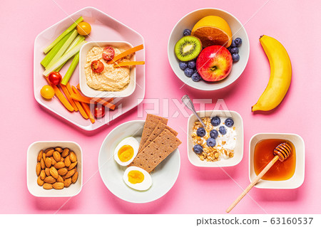 Healthy snack on a pastel background. Healthy snack on a pastel background. 63160537