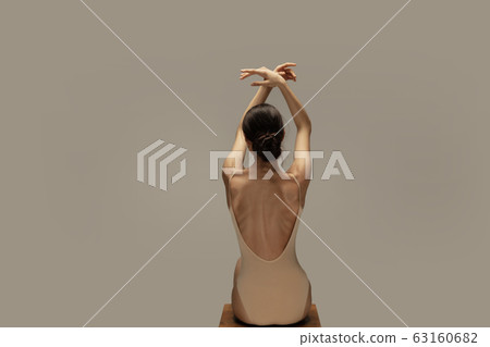 Young graceful tender ballerina on pastel studio background Young graceful tender ballerina on pastel studio background 63160682