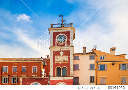 A red clock tower at The Marsala Tita Square. A red clock tower at The Marsala Tita Square. 63161953
