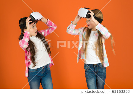 Discover virtual reality. Kids girls play virtual Discover virtual reality. Kids girls play virtual 63163293