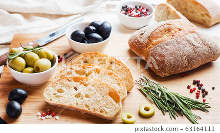 Italian ciabatta bread with olives and rosemary on 63164111
