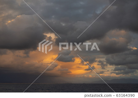 Beautiful Sunset With Fiery Clouds Near The West Cost Of Canada Beautiful Sunset With Fiery Clouds Near The West Cost Of Canada 63164390