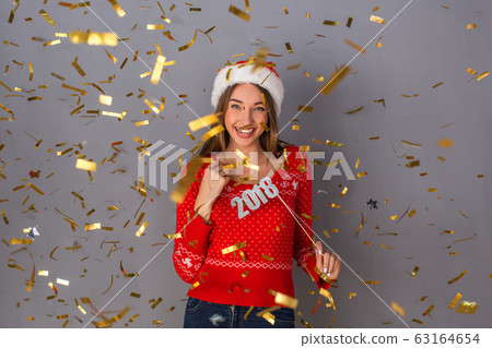 Young person studio isolated on grey wall Young person studio isolated on grey wall 63164654
