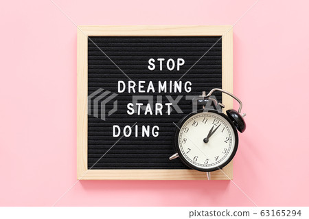Stop Dreaming Start Doing. Motivational quote on Stop Dreaming Start Doing. Motivational quote on 63165294