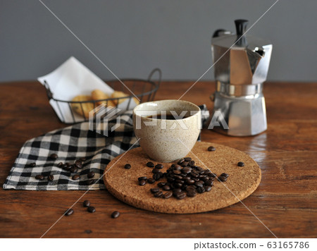 Moka pot coffee maker and coffee cup, steel Moka pot coffee maker and coffee cup, steel 63165786