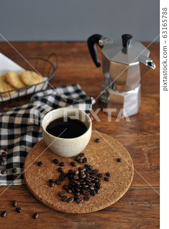 Moka pot coffee maker and coffee cup, steel Moka pot coffee maker and coffee cup, steel 63165788