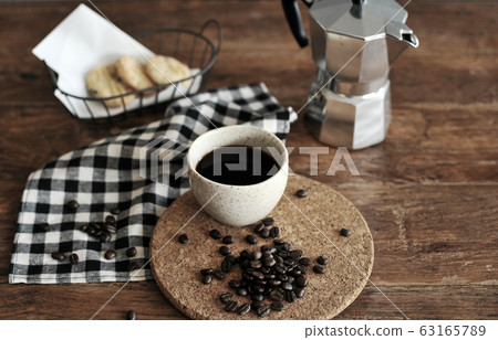 Moka pot coffee maker and coffee cup, steel Moka pot coffee maker and coffee cup, steel 63165789