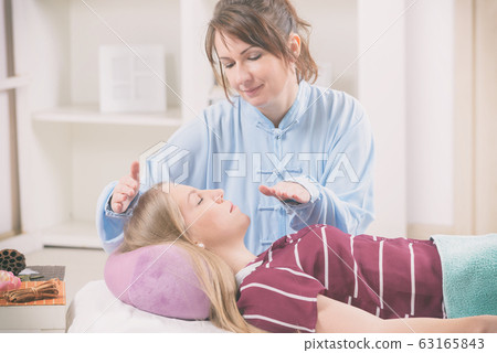 Professional Reiki Healer Doing Reiki Stock Photo