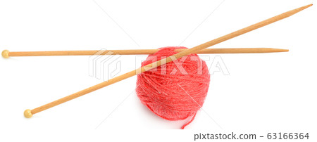 Ball of wool and knitting needles isolated on 63166364