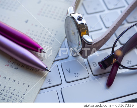 Business image · calendar · keyboard · glasses · female 63167339
