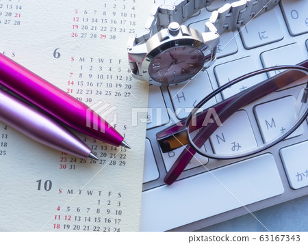Business image · calendar · keyboard · glasses · female Business image · calendar · keyboard · glasses · female 63167343