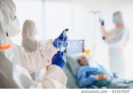 Looking after infected patients in hospital, coronavirus concept. Looking after infected patients in hospital, coronavirus concept. 63167687