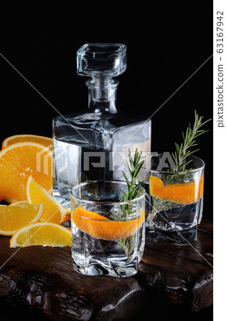 Classic Dry Gin with tonic and orange zest 63167942