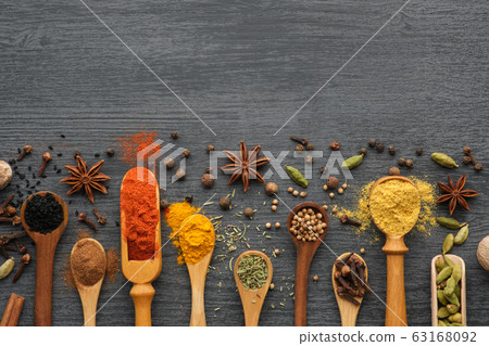 Various aromatic spices and herbs in spoons 63168092
