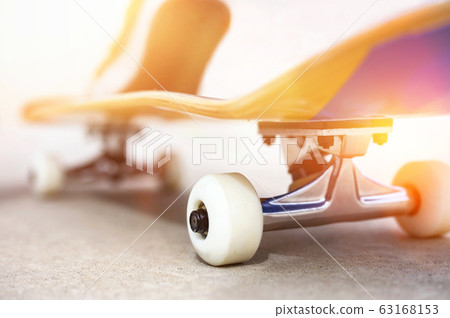 Close up of a skate board at sunset at the skate park. 63168153