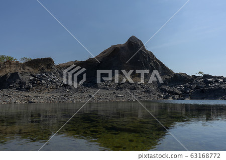 Granite mountains with blue sky background. Granite mountains with blue sky background. 63168772