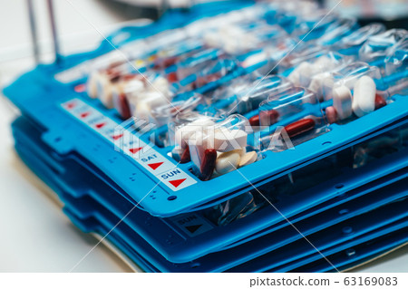 Pills in blisters for every day of the week for the morning, day, night time. Medications for patients in a hospital 63169083