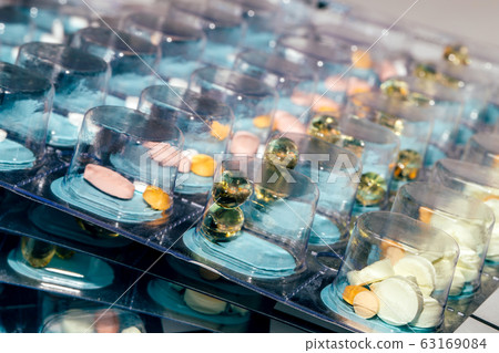 Pills in blisters for every day of the week for the morning, day, night time. Medications for patients in a hospital 63169084