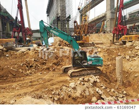 Excavators machine is heavy construction machine used to excavate soil and lifting material at the construction site. Powered by the hydraulic arm with a bucket.   63169347