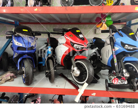 Various types of bikes are on display in the store. Kids bike to an adult bike. 63169488