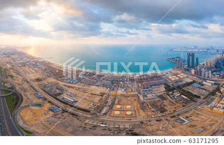 Aerial view of petrochemical oil refinery and sea 63171295