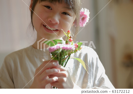 Girl with floral ornament 63172212