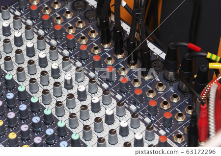 Detail of a music mixer desk with various knobs Detail of a music mixer desk with various knobs 63172296