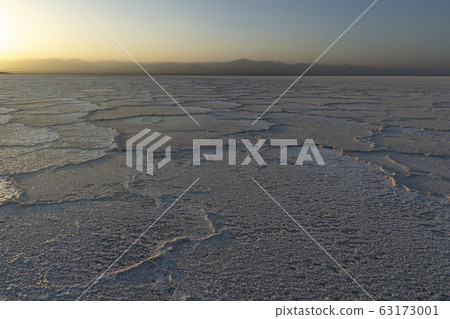 Sunset on the salt plains of Asale Lake in the Danakil Depression in Ethiopia. Sunset on the salt plains of Asale Lake in the Danakil Depression in Ethiopia. 63173001