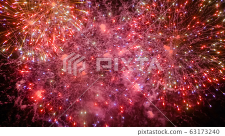 Christmas concept - colorful fireworks in dark sky at night Christmas concept - colorful fireworks in dark sky at night 63173240