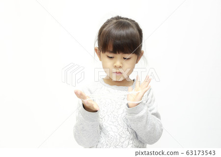Infant (five-year-old) doing iris (white background) Infant (five-year-old) doing iris (white background) 63173543