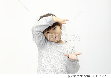 Infant (five-year-old) doing iris (white background) Infant (five-year-old) doing iris (white background) 63173545