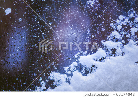 Winter ice patterns on glass. Frost patterns on 63174048