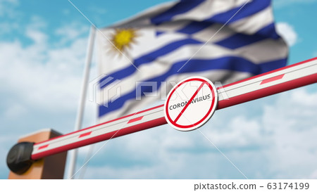 Closing boom barrier with STOP CORONAVIRUS sign against the Uruguayan flag. Quarantine in Uruguay. 3D rendering  63174199