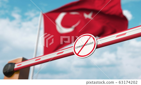 Closed boom gate with STOP CORONAVIRUS sign on the Turkish flag background. Quarantine in Turkey. 3D rendering  63174202