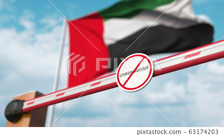 Closing boom barrier with STOP CORONAVIRUS sign against the UAE flag. Quarantine. 3D rendering Closing boom barrier with STOP CORONAVIRUS sign against the UAE flag. Quarantine. 3D rendering 63174203