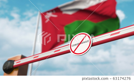 Closing boom barrier with STOP CORONAVIRUS sign against the Omani flag. Quarantine in Oman. 3D rendering Closing boom barrier with STOP CORONAVIRUS sign against the Omani flag. Quarantine in Oman. 3D rendering 63174276
