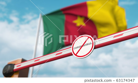 Closed boom gate with STOP CORONAVIRUS sign on the Cameroonian flag background. Quarantine in Cameroon. 3D rendering  63174347