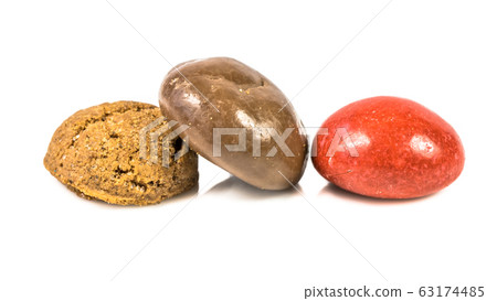 Colored pepernoten treats on white background Colored pepernoten treats on white background 63174485