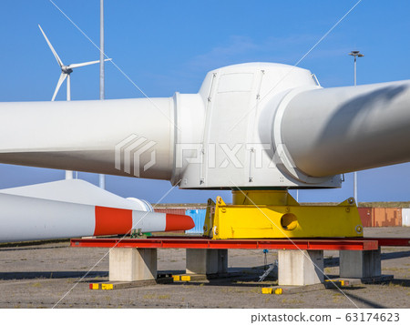 Giant rotors of wind turbine under clear blue sky Giant rotors of wind turbine under clear blue sky 63174623